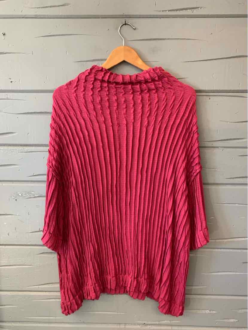 Bright pink crinkle cardigan with a loose fit, long sleeves, and textured pleats.