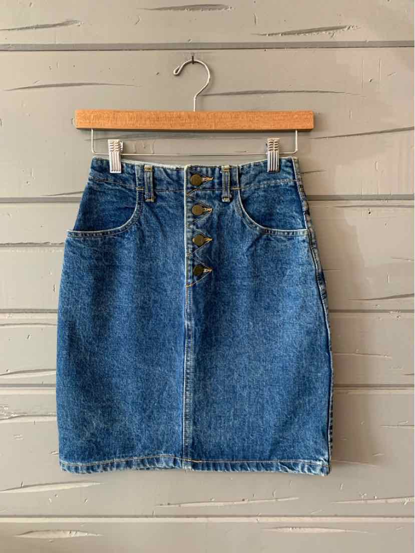 Blue denim skirt with front button closure and two front pockets, size 4.