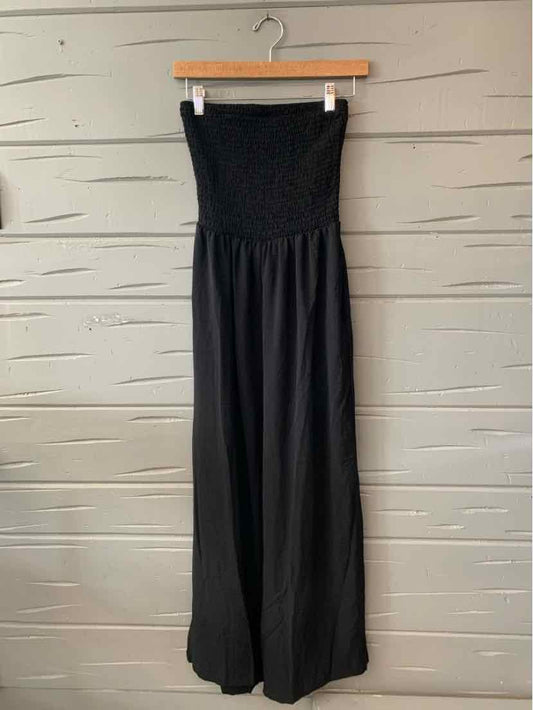 Black strapless wide-leg jumpsuit with fitted elastic bodice and flowing pant legs.
