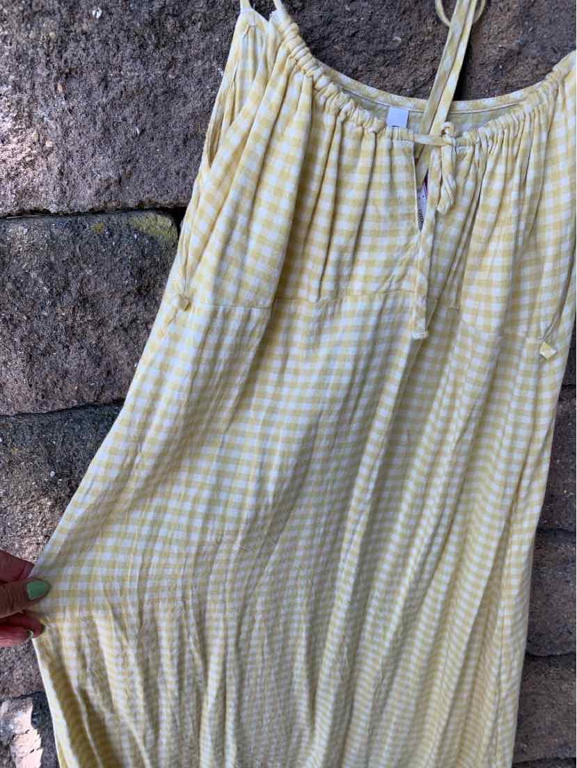 Yellow and white gingham dress with spaghetti straps and drawstring neckline.
