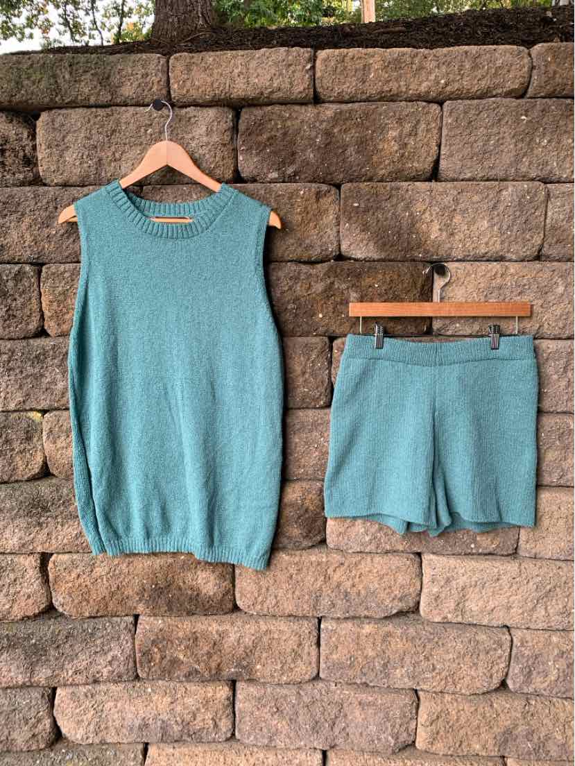 Two-piece teal knit set with a sleeveless top and matching elastic-waist shorts.