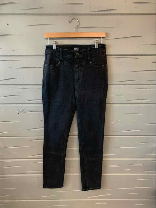 Black high-waist skinny jeans with front pockets and button closure, size 6.