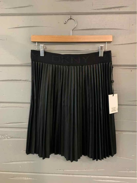 Black pleated mini skirt with elastic waistband and DKNY tag on side.