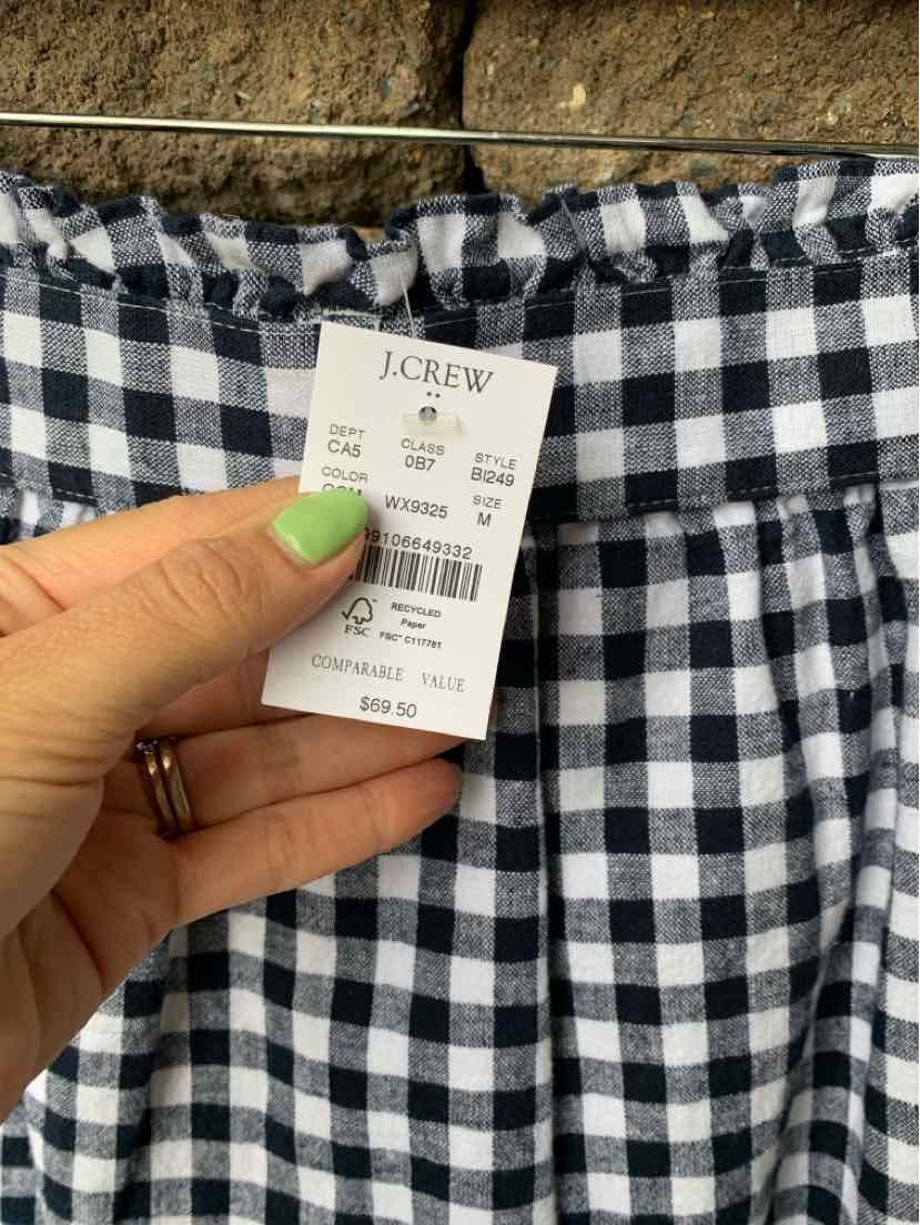 Black and white gingham skirt with gathered elastic waistband and J.Crew tag attached.