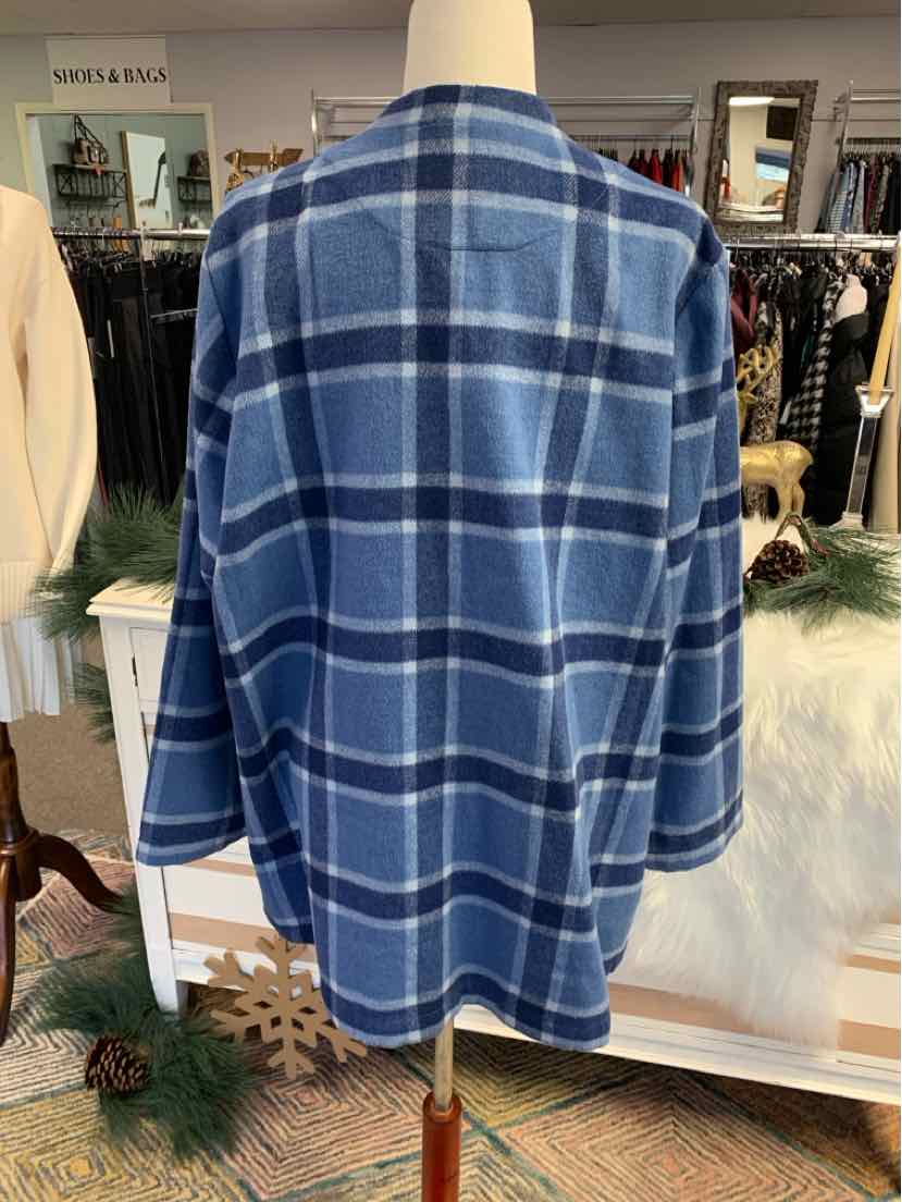 Blue and white plaid oversized denim shirt with long sleeves on mannequin.