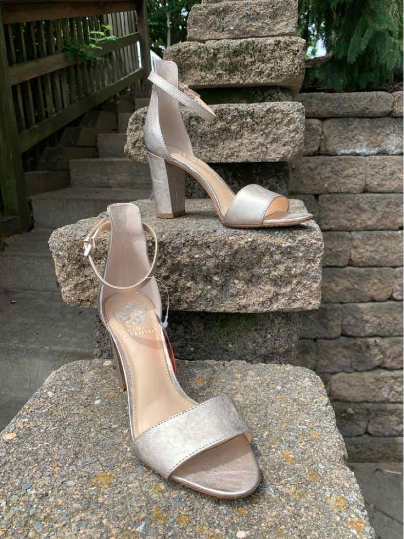 Metallic gold open-toe ankle strap high heel sandals with slim stiletto heel and padded insole.