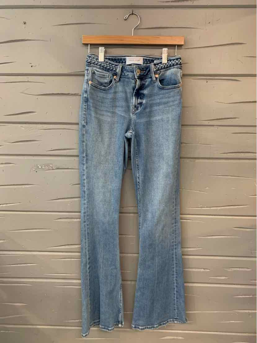 Light blue denim jeans with high waist, button fly, and slight flare hem.