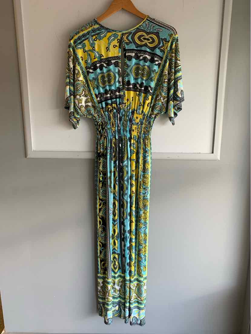 Long paisley print dress in blue, green, yellow, and black with cinched waist and short sleeves hanging on wooden hanger.