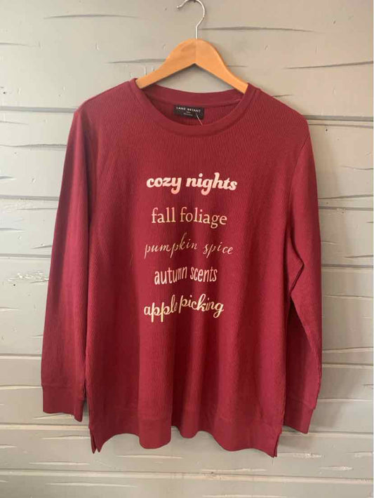 Long-sleeve burgundy sweatshirt with cozy fall-themed text in cream on front, relaxed fit.