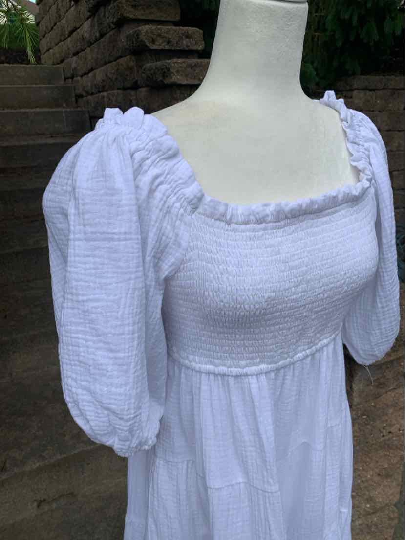 White textured fabric dress with puffed long sleeves and square neckline, size XL.