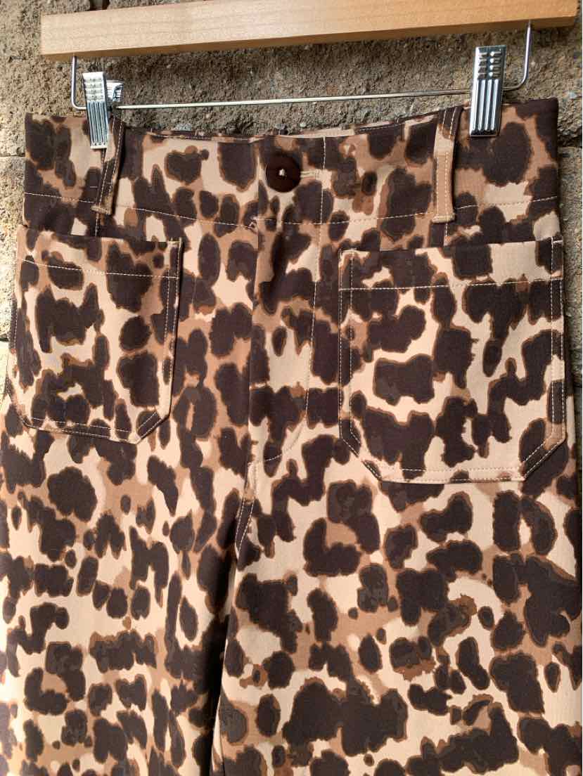 Brown and tan cheetah-print trousers with a straight-leg cut and front pockets.