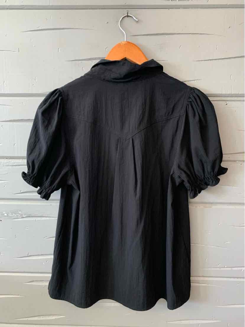 Black blouse with puffed short sleeves and a fitted waist, button-up back, lightweight fabric.