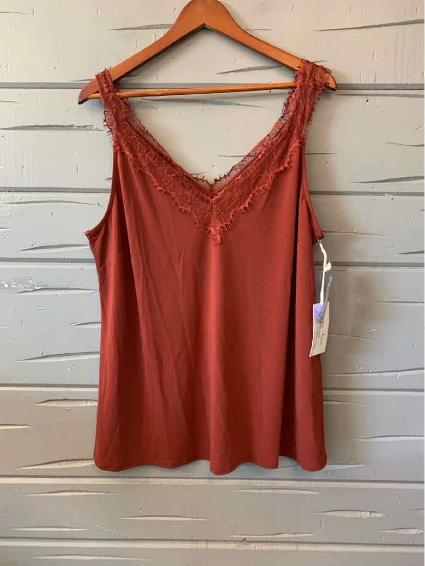 Rust orange women's casual top with lace trim and adjustable shoulder ties, size large.