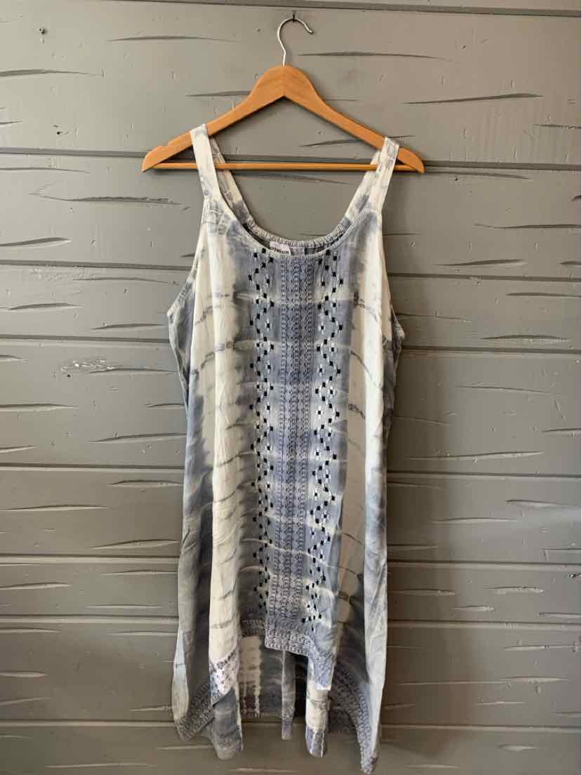 Sleeveless tie-dyed sundress in blue and white with geometric patterns and a flowy, asymmetrical hem.