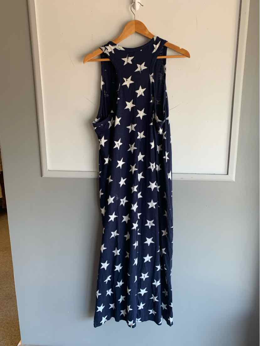 Navy blue sleeveless maxi dress with white star print and relaxed fit.