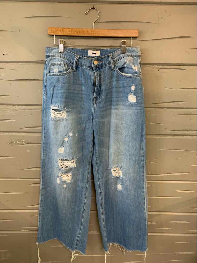 Light blue distressed denim jeans with wide legs, five-pocket design, and frayed hems.