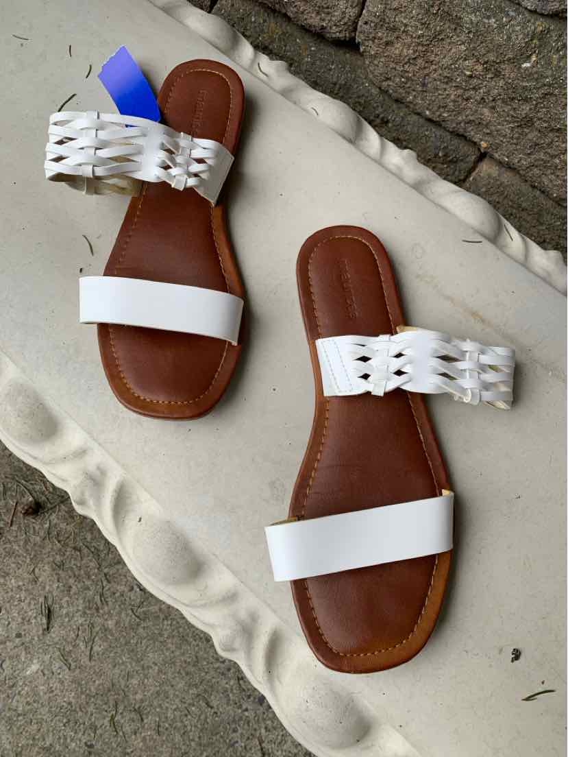 Brown flat sandals with white double straps, one braided and one plain, size 9.