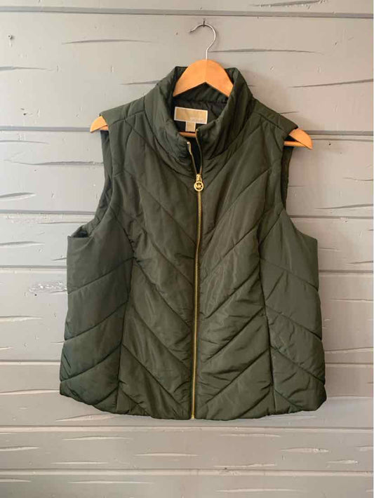 Dark green quilted sleeveless vest with gold zipper and stand collar, size 1X.