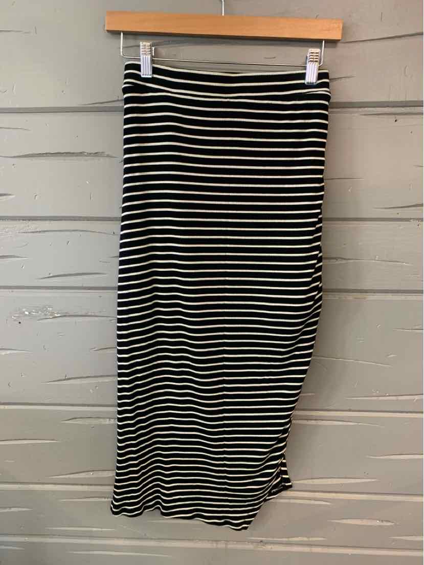 Black and white horizontal striped pencil skirt in size XS hanging on wooden hanger.