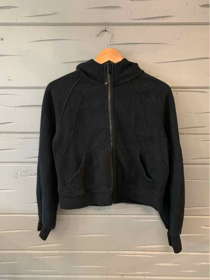 Black zip-up hoodie with kangaroo pockets and drawstring hood, size XS/S, lightweight fabric.