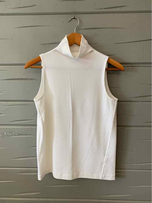 White sleeveless turtleneck top with smooth fabric and a clean, fitted silhouette.