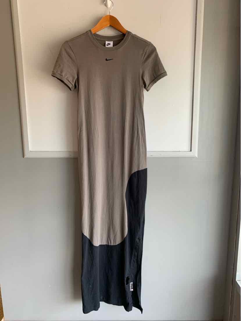 Women's Nike short-sleeve maxi dress in brown with black ombre color block at the hem.