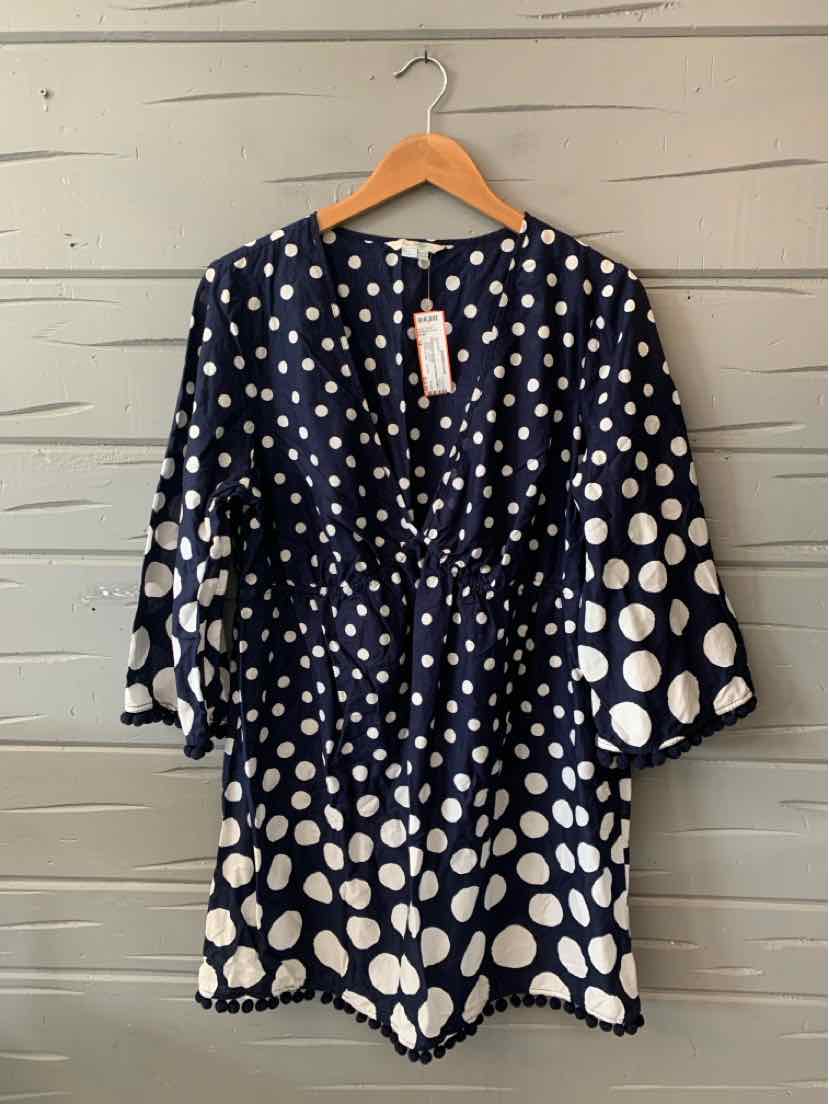 Navy blue dress with white polka dots, gathered waist, V-neck, and three-quarter bell sleeves.