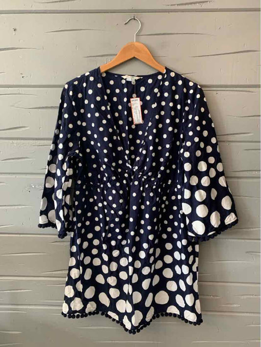 Navy blue dress with white polka dots, gathered waist, V-neck, and three-quarter bell sleeves.
