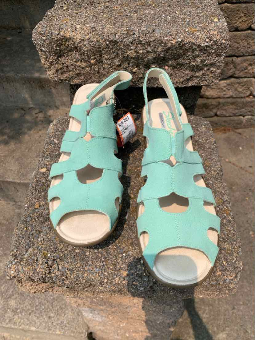 Women's teal leather open-toe sandals with cutout design and ankle strap, size 10.
