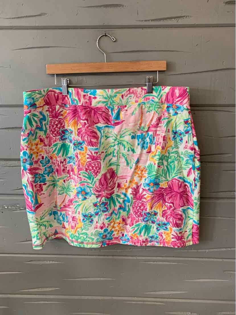 Colorful tropical print skort with pink, green, and blue floral design, size 1X, hanging on wooden hanger.