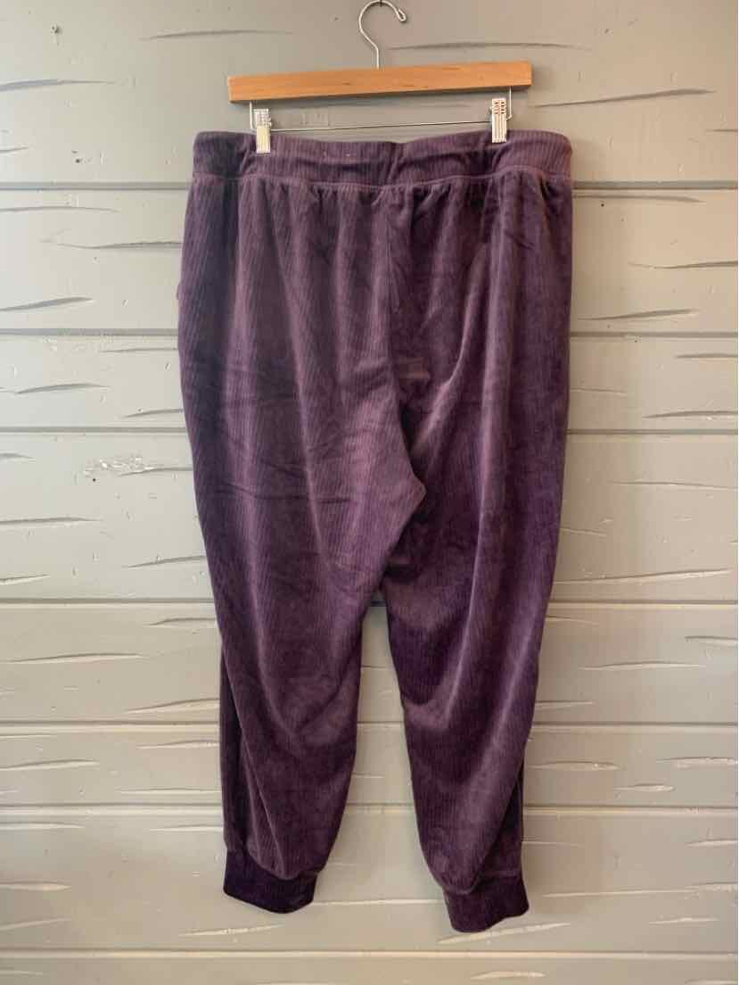 Dark purple plush jogger pants with elastic waistband and cuffs, relaxed fit.