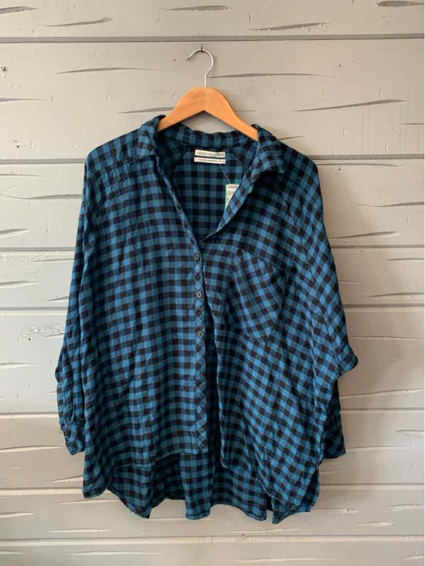 Blue and black checkered flannel shirt with long sleeves and button-up front, medium size.