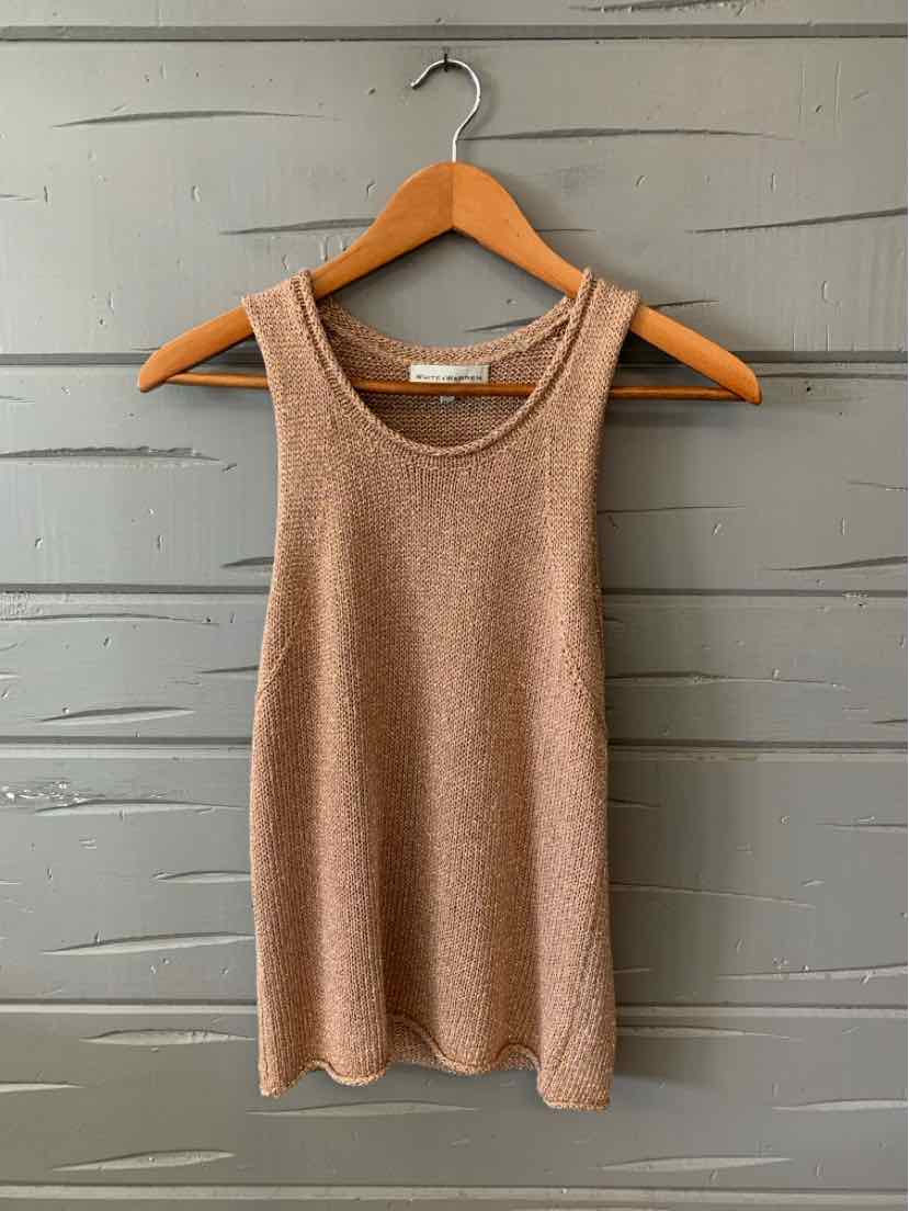 Tan sleeveless knit tank top with scoop neckline hanging on wooden hanger.