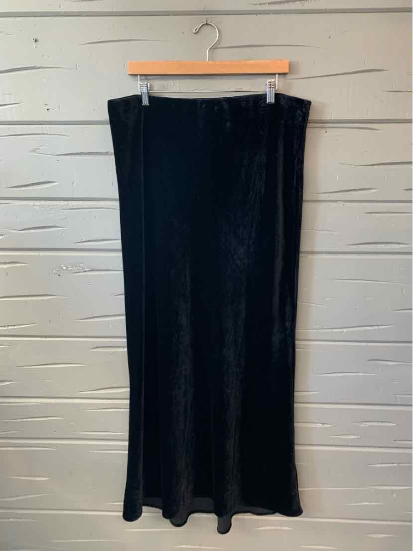 Black velvet midi skirt with slight flare and smooth texture, size 1X.