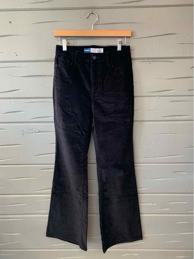 Black Old Navy corduroy pants with straight legs, displayed hanging against a light wall.