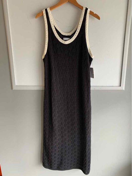 Black sleeveless knit dress with white trim around neckline and armholes, size XXL.