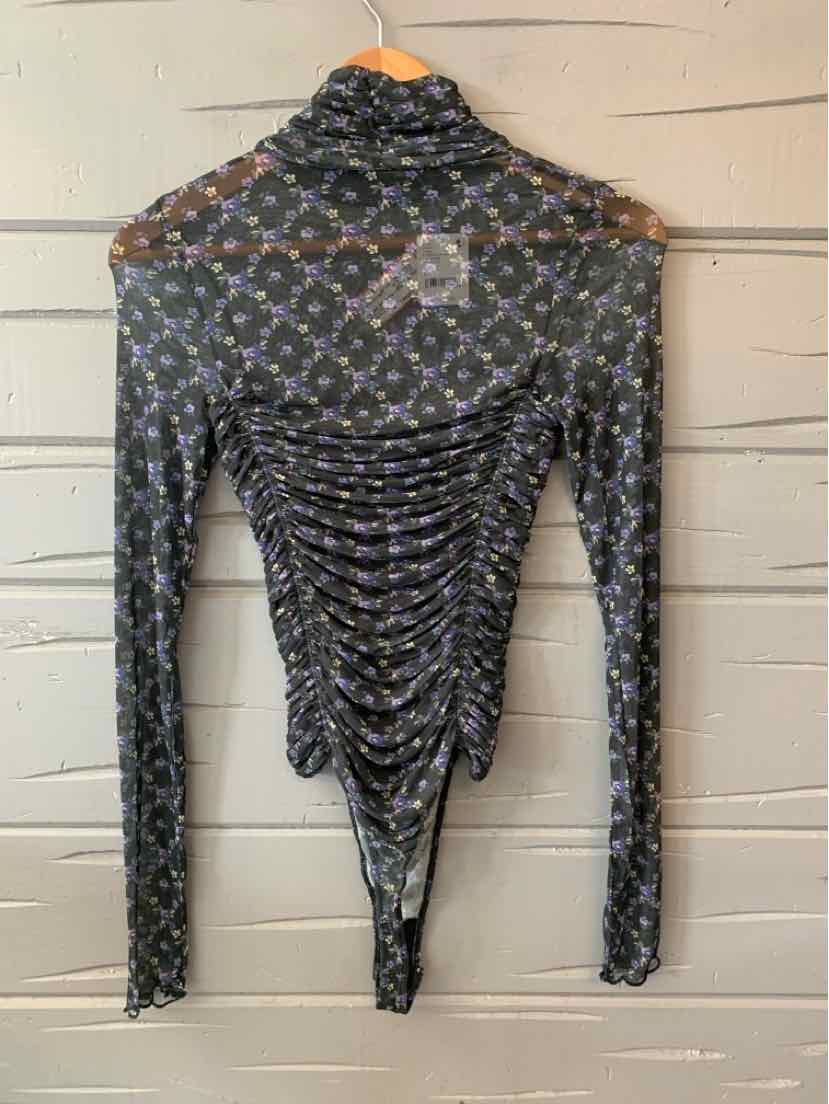 Black sheer long-sleeve bodysuit with floral pattern and ruched back detail.