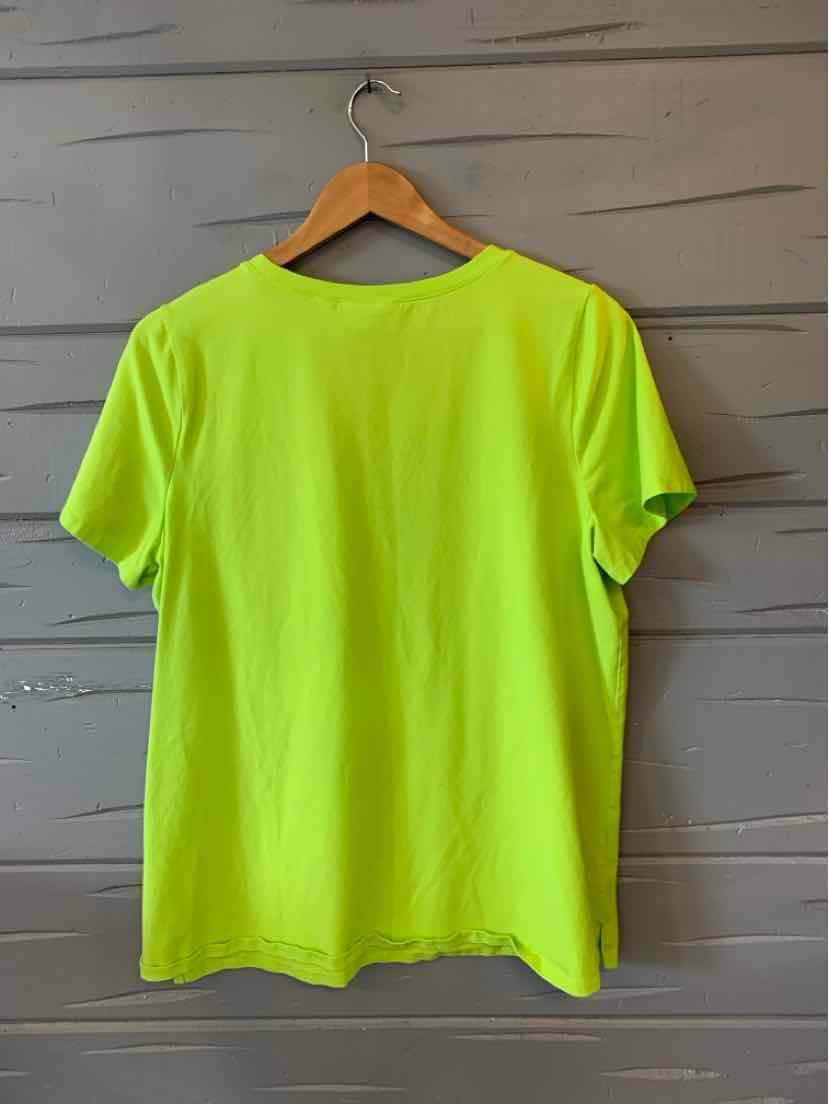 Bright lime green short-sleeve t-shirt with a relaxed fit hanging on wooden hanger.