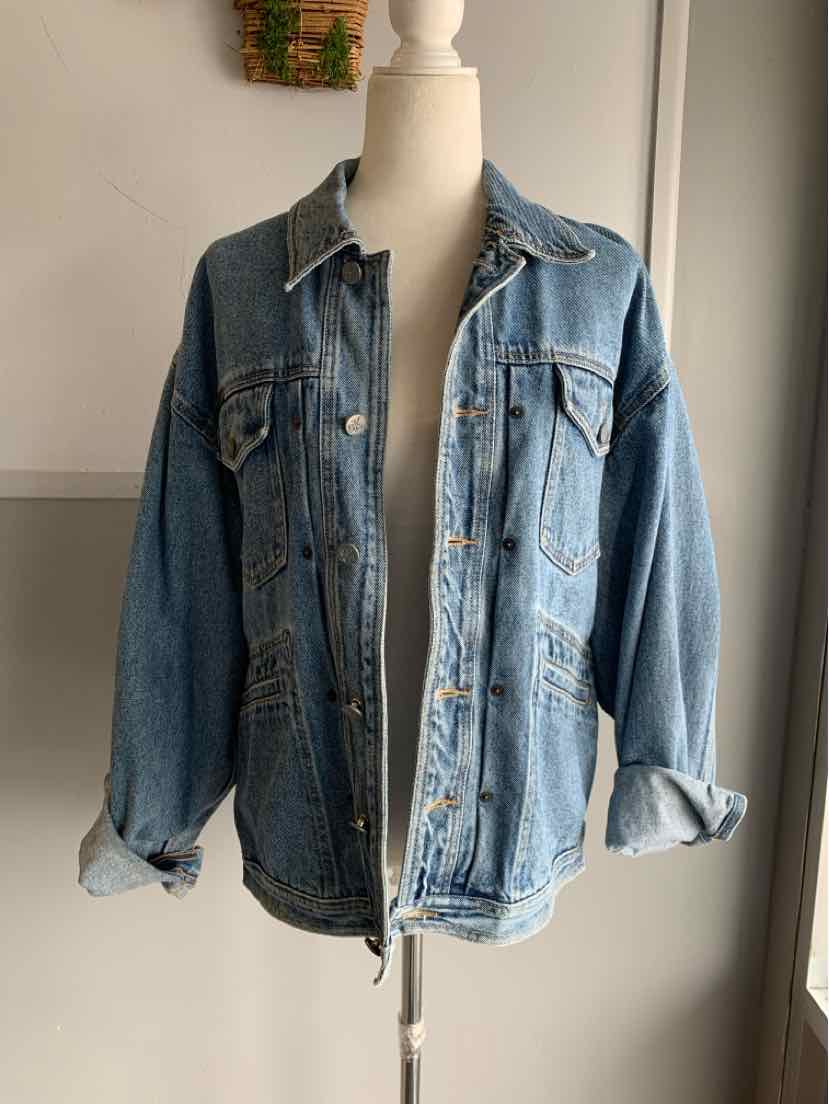 Men's medium blue denim Calvin Klein jacket with button front and chest pockets.