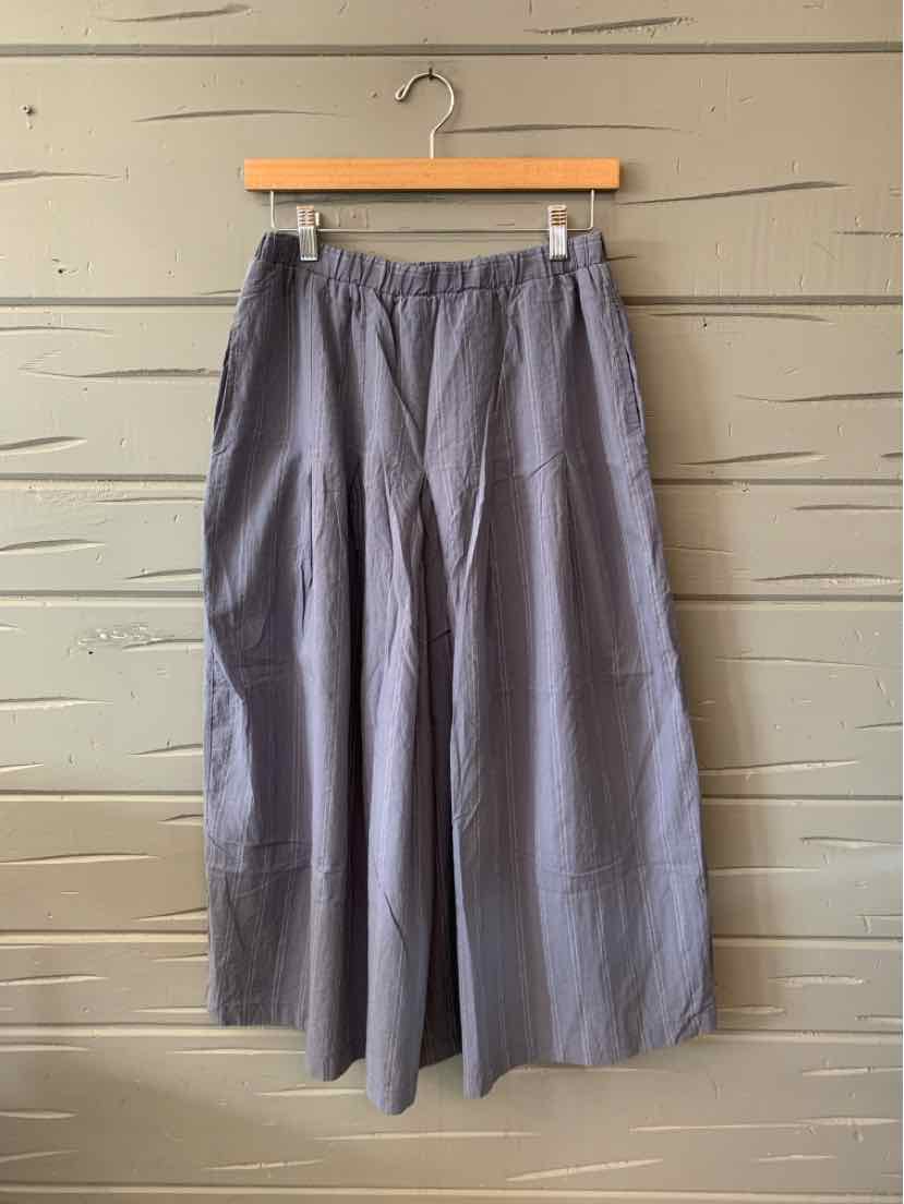 Wide-leg medium-length pants in muted blue with an elastic waistband and subtle vertical stripes.