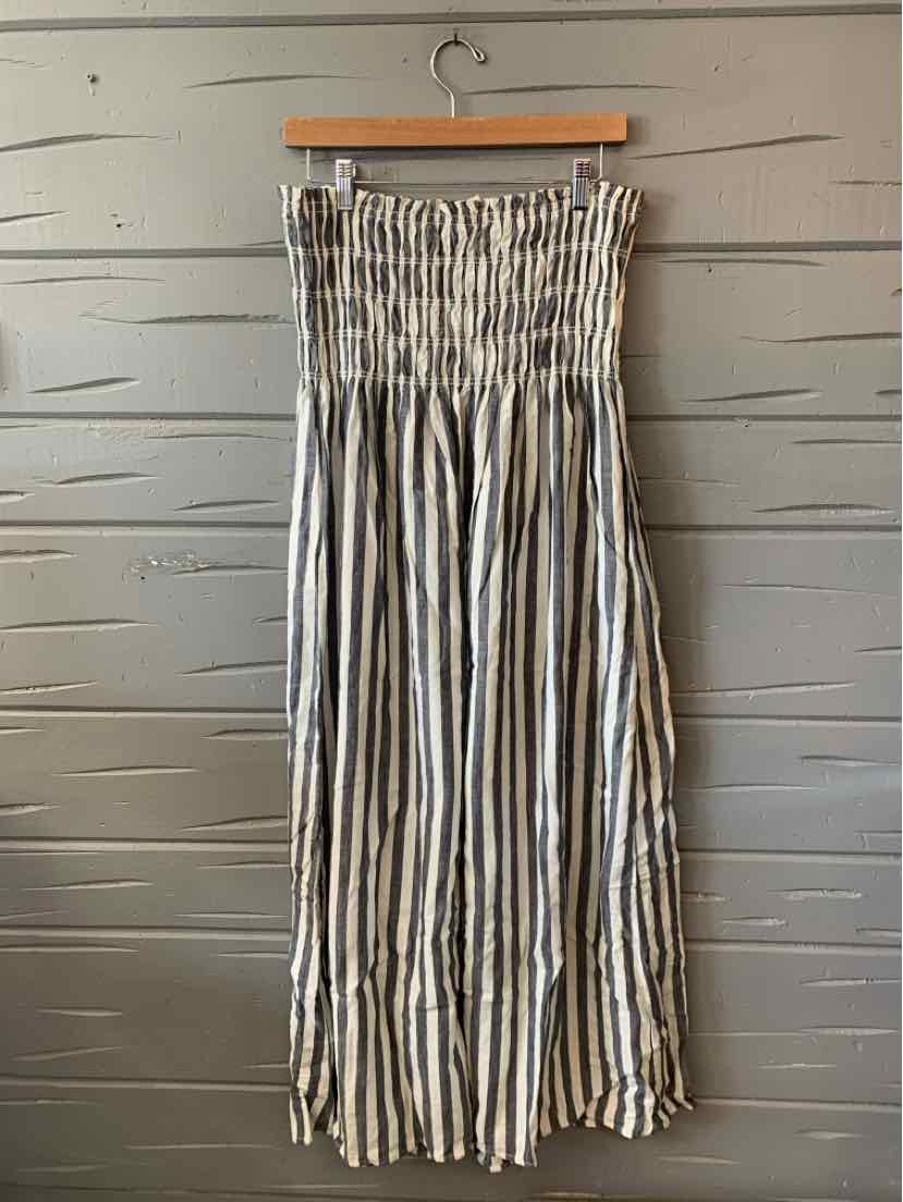 Gray and white vertical striped strapless midi dress with smocked bodice and flowy skirt.