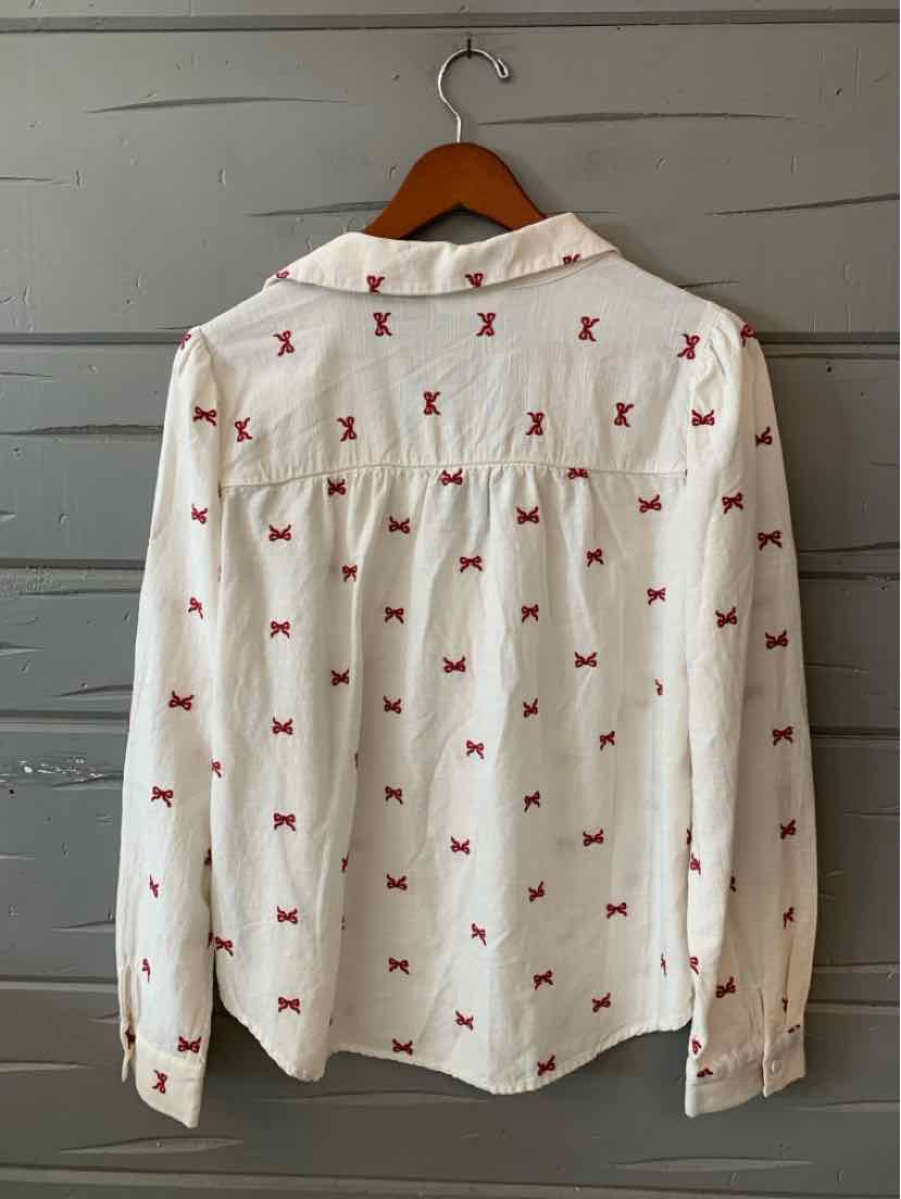 White long-sleeve blouse with small red bow prints and a gathered yoke back detail.