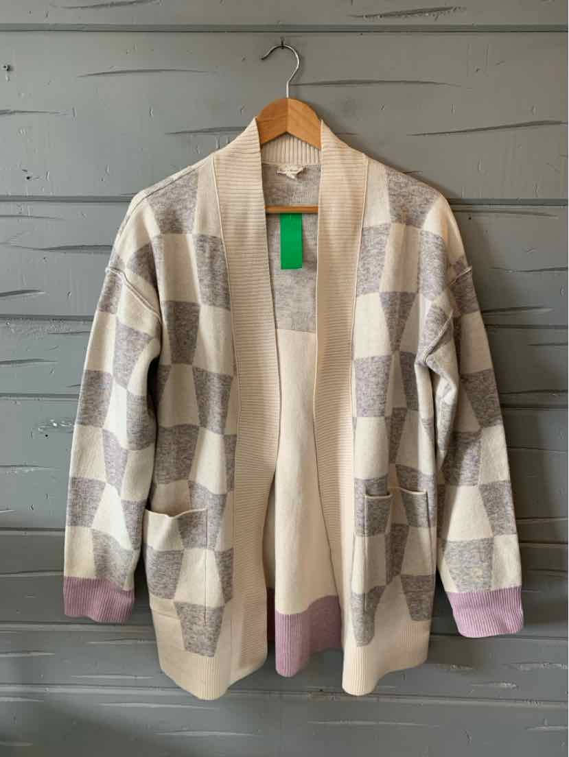 Light beige open-front cardigan with cream and light brown checkered pattern, ribbed cuffs, and a relaxed fit.