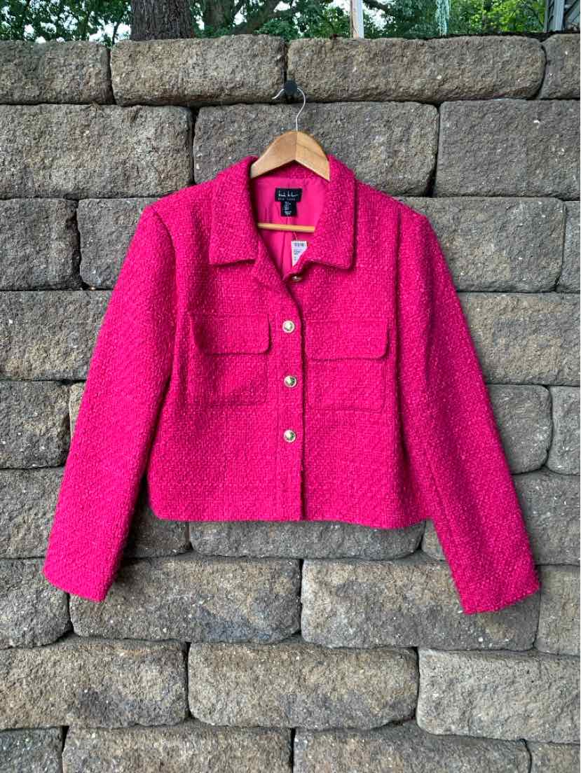Bright pink tweed blazer with structured collar, front flap pockets, and silver buttons.