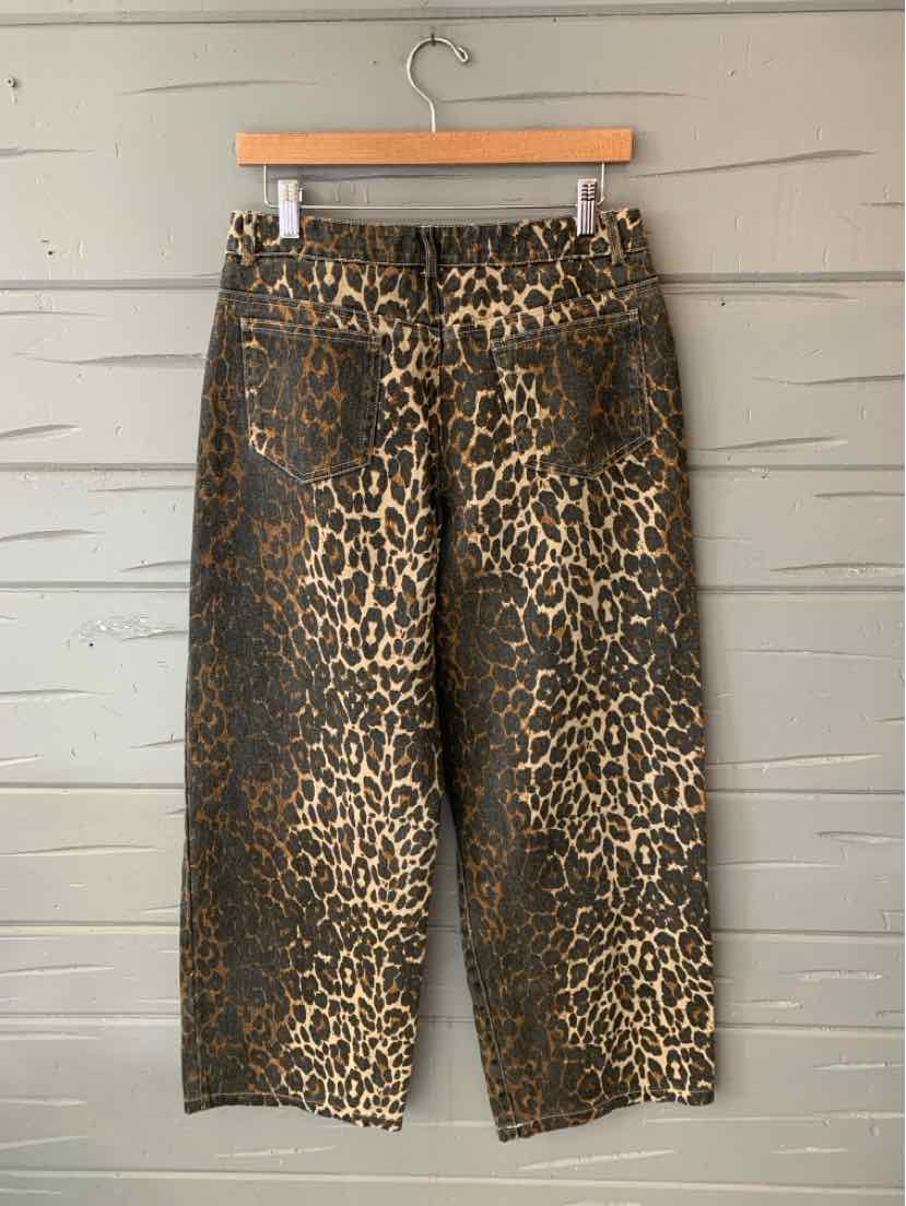 Brown and black cheetah-print wide-leg pants with a gathered elastic waistband.