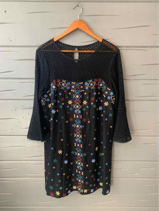 Black long-sleeve dress with colorful embroidered floral patterns and flared cuffs, size 14.