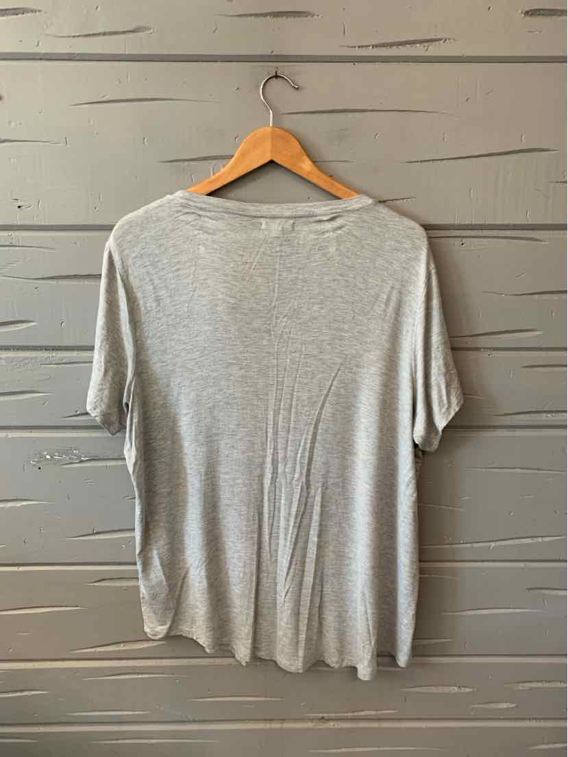 Light gray short-sleeve relaxed fit T-shirt with rounded neckline hanging on wooden hanger.