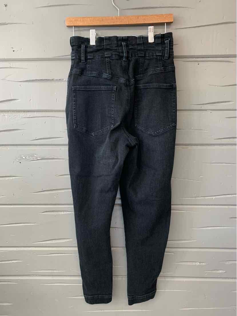 Black high-waist denim jeans with tapered legs and back pockets, size 4, hanging on wooden hanger.