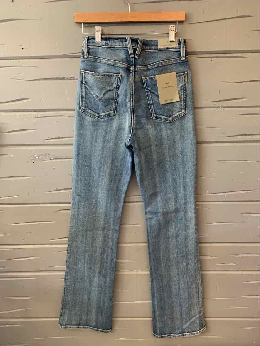 Light blue straight-leg denim jeans with back pockets and a leather brand patch on the waistband.