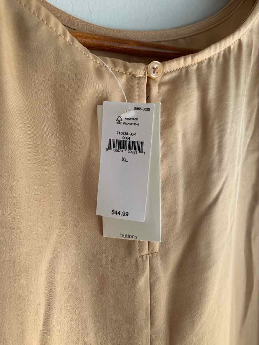 Light beige Banana Republic blouse with round neckline and button closure at back, size XL tag visible.